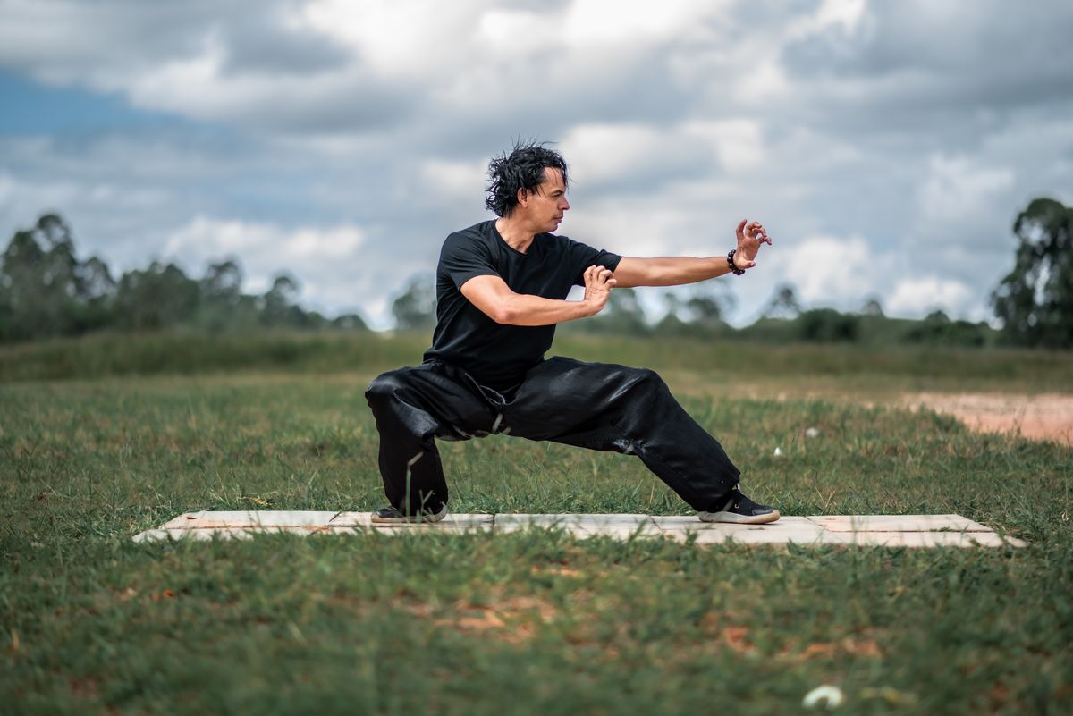 Qigong practitioner performing a gentle neck-turning movement