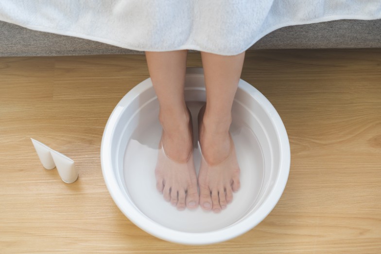 Relaxing with a hot foot soak before bed