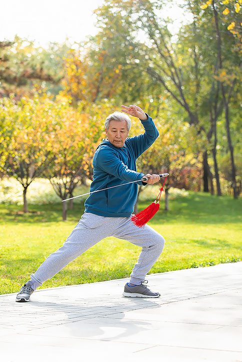 Tai chi sword opening stance, bow stance holding sword forward